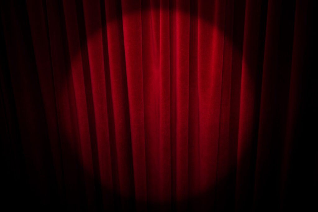 Hintergrundbild. Zeigt einen roten Vorhang.